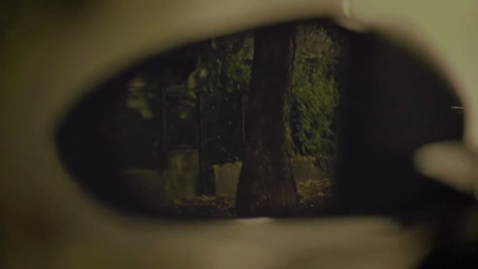 The side mirror shows an empty street.