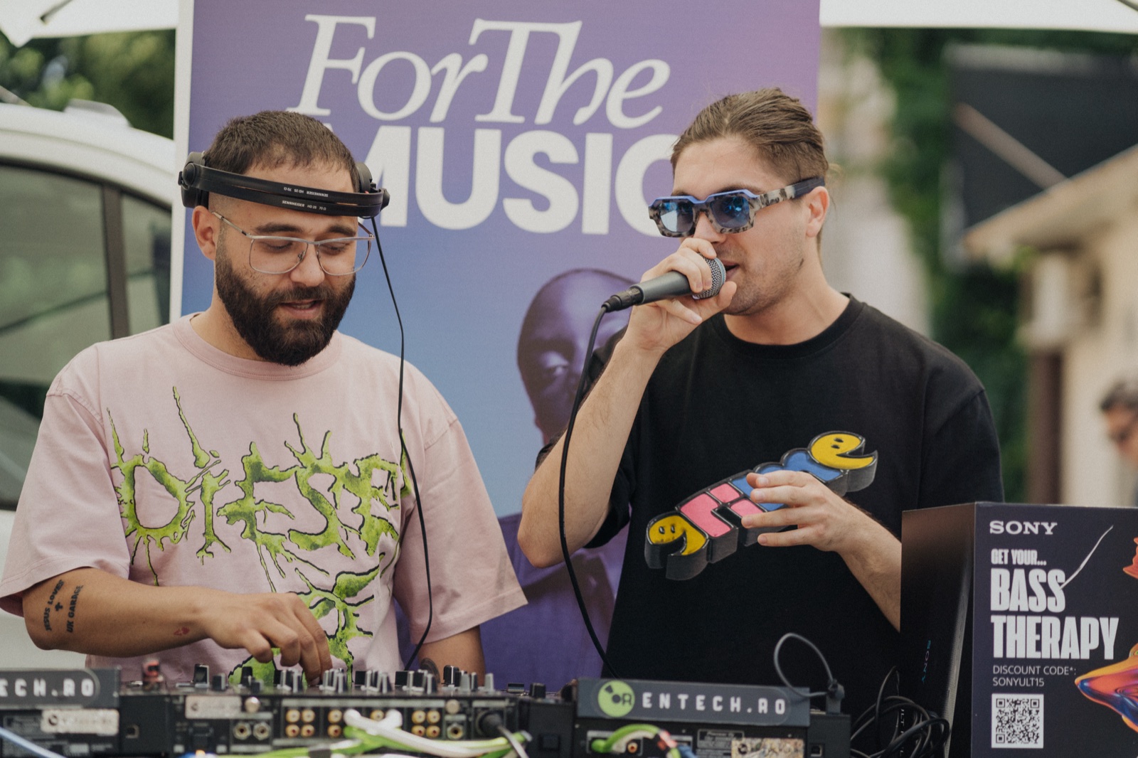 Psihotrop and DJ Kamal on the decks at the first Bass Therapy session, with the branded cube beside them.